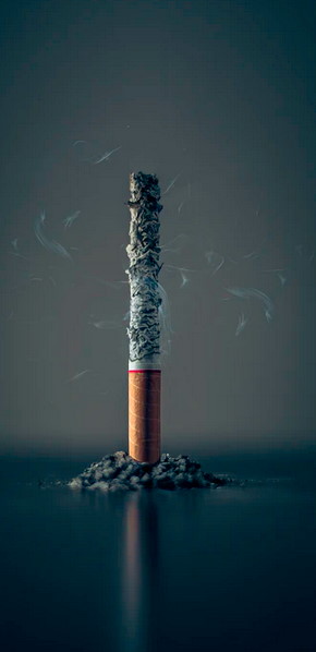 palący sie papieros - czynnik ryzyka